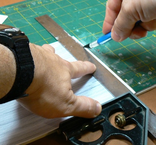 Photograph of squaring up the  Bristol Board
 used to make the HO scale metal roofing