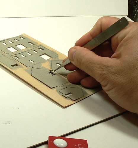 Adding upper window trim to the Curtis Bros Plumbing Supply Model railroad Kit.