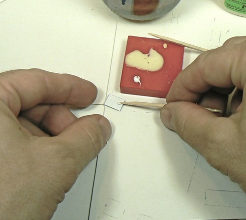 Adding some signs to the Curtis Bros. Plumbing Supply Co Z-scale model railroad kit