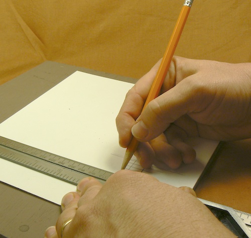 Photograph of using a square to mark guidelines for the placement of the joists for 
the Z-scale loading dock jig