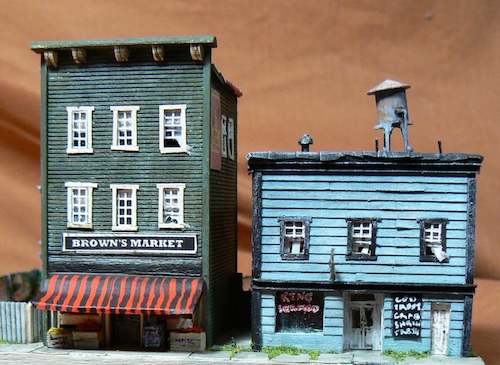 Photograph of
two different window screen windows in a Z-scale scratchbuilt stores for a model railroad